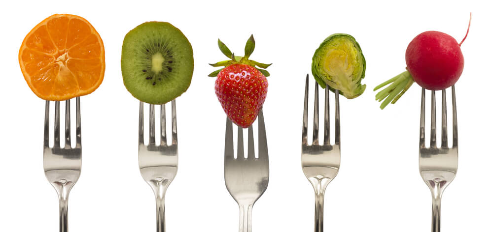 photo of fruits and vegtables on forks